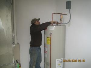 Plumber installs a new Bradford White 50 gallon water heater